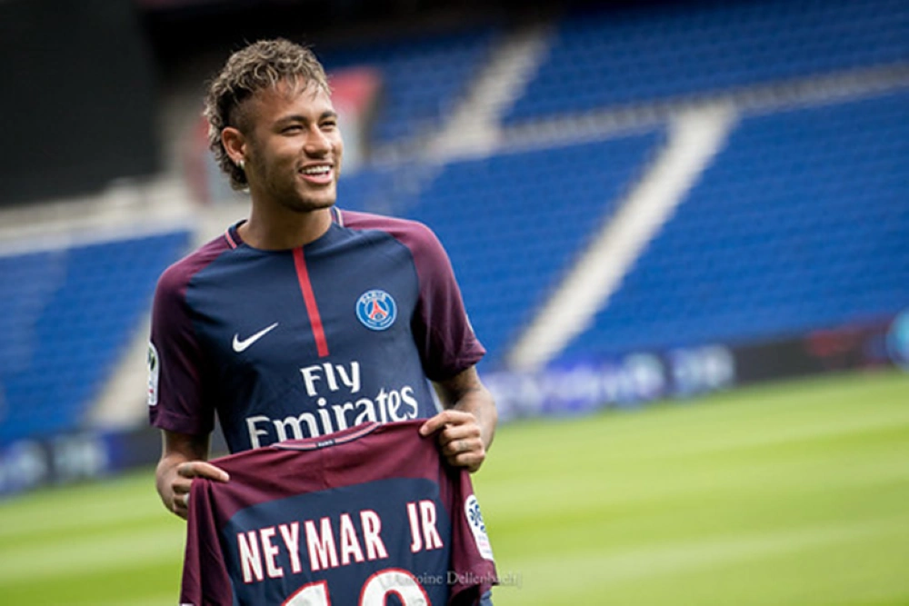 Neymar - proudly presenting his shirt